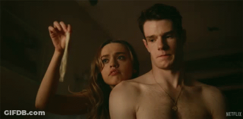 Man Holding Condom Next To Woman Saying Where's The Spunk GIF
