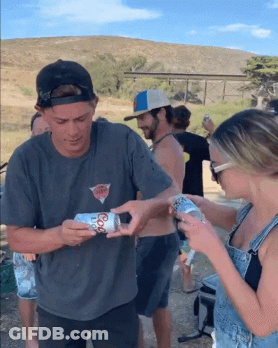 Man Holding Coors Light Can Woman Looking On GIF