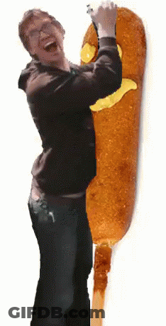 Man Holding Corn Dog With Yellow Face GIF
