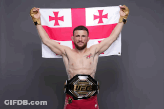 Man Holding Cross Flag And UFC Belt GIF