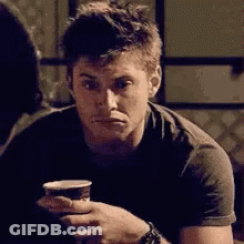 Man Holding Cup Of Coffee GIF