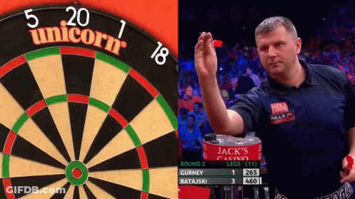 Man Holding Dart In Front Of Unicorn Dart Board GIF