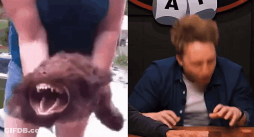 Man Holding Dog Next To Sign GIF