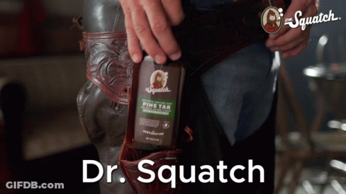 Man Holding Dr. Squatch Pine Tar Bottle GIF