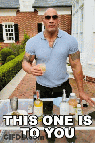 Man Holding Drink Saying This One Is To You GIF