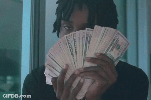 Man Holding Fan Of Fifty Dollar Bills GIF