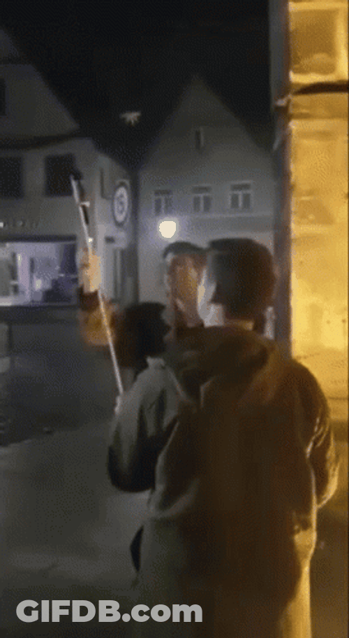 Man Holding Fireworks Firecracker Rocket GIF