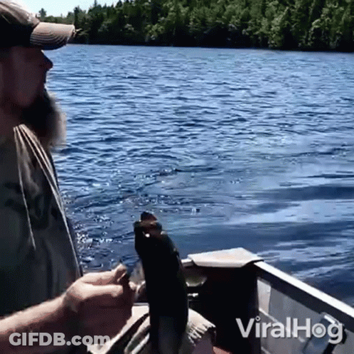 Man Holding Fish In Boat Viralhog GIF