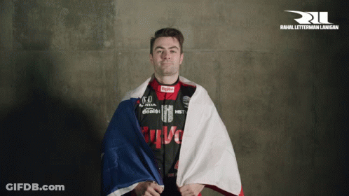 Man Holding Flag At Rahul Letterman Land Sign GIF
