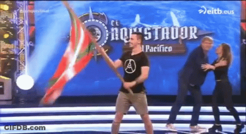 Man Holding Flag On Stage Saying El Pacifico GIF