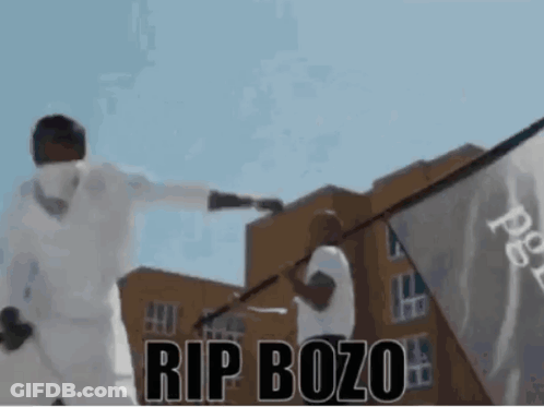 Man Holding Flag Saying Rip Bozo GIF