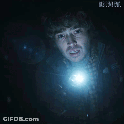 Man Holding Flashlight In Dark Room Resident Evil GIF