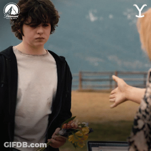 Man Holding Flowers And Paramount Network Logo GIF