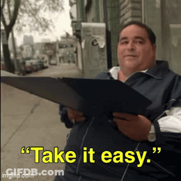 Man Holding Folder Saying Take It Easy GIF