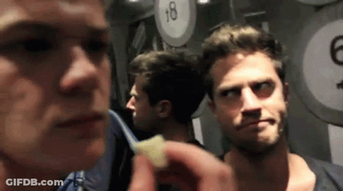 Man Holding Food In Front Of 18 Sign GIF