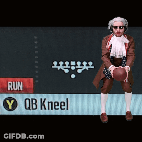 Man Holding Football In Front Of Run Sign GIF