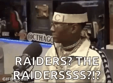 Man Holding Football With Chair Over Head GIF