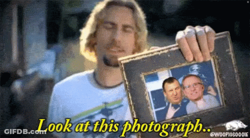 Man Holding Framed Picture Saying Look At This Photograph GIF