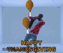 Man Holding Fried Chicken Legs Saying Happy Thanksgiving GIF