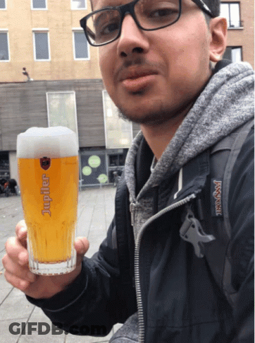 Man Holding Glass Of Jupiter Beer GIF