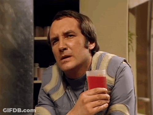 Man Holding Glass Of Red Liquid GIF