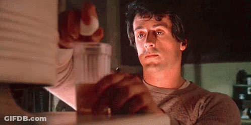 Man Holding Glass Of Water In Front Of Microwave GIF