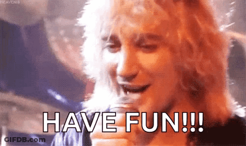 Man Holding Glass Saying Have Fun GIF