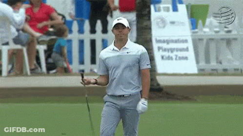 Man Holding Golf Club At Playground GIF
