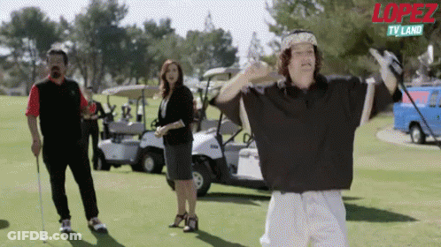 Man Holding Golf Club With Lopez TV Land Logo GIF
