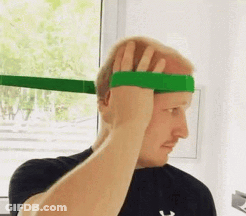 Man Holding Green Rubber Band On Head GIF
