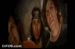 Man Holding Guitar Next To Man With Bandana GIF