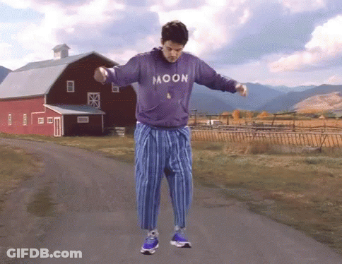 Man Holding Guitar Wearing Moon Shirt GIF