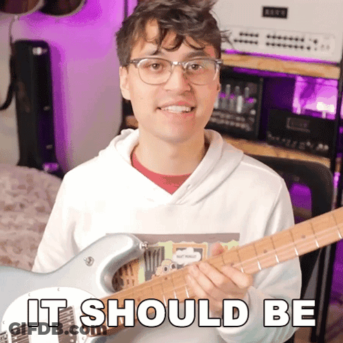Man Holding Guitar With It Should Be GIF