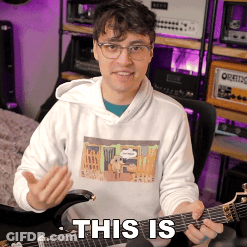 Man Holding Guitar With This Is GIF