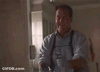 Man Holding Gun And Smiling While Standing In Room GIF