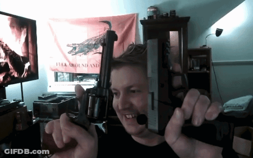 Man Holding Gun At Flag Saying Fuck Around And GIF