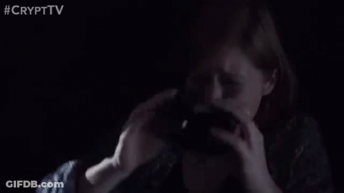 Man Holding Gun In Dark Room GIF