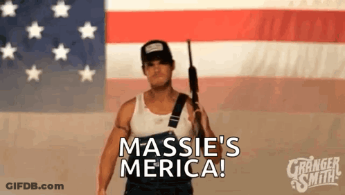 Man Holding Gun In Front Of American Flag GIF