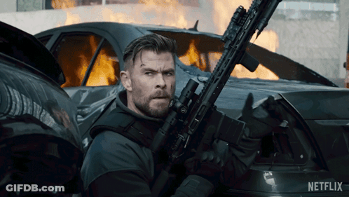 Man Holding Gun In Front Of Burning Car Netflix GIF