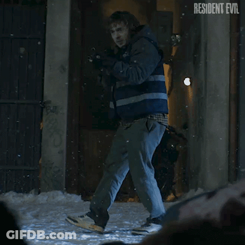 Man Holding Gun In Front Of Resident Evil Building GIF