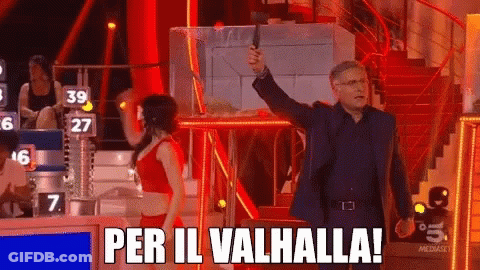Man Holding Gun In Front Of Woman Saying Per Il Valhalla GIF