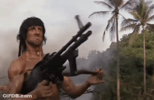 Man Holding Gun In Jungle GIF