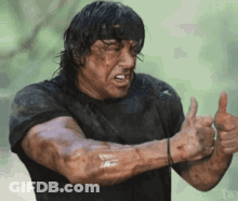 Man Holding Gun In Jungle GIF