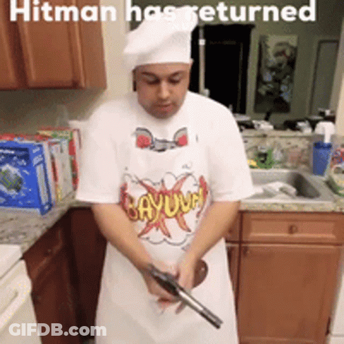Man Holding Gun In Kitchen Hitman Has Returned GIF
