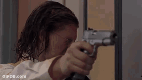 Man Holding Gun In Room GIF