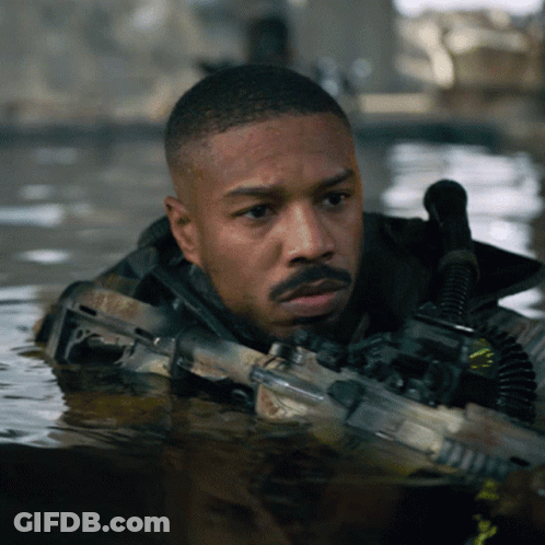 Man Holding Gun In Water GIF