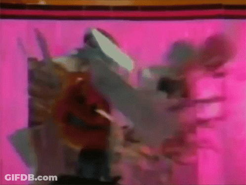 Man Holding Gun Pink Background GIF