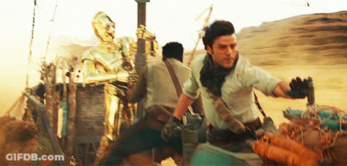 Man Holding Gun Riding Motorcycle In Desert With Robot GIF