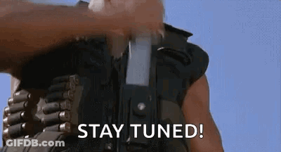 Man Holding Gun Saying Stay Tuned GIF