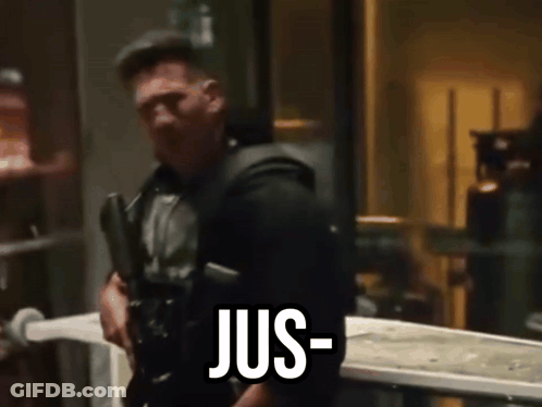 Man Holding Gun Says Jus GIF